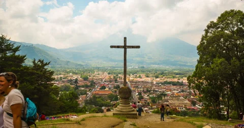 Time Lapse of group of tourists walking near the crucifix in Guatemala City Stock Footage 64401065