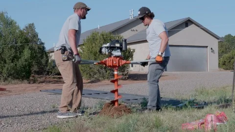 Time Lapse of Guys Putting Posts in the Ground for a Fence Stock Footage 94868190