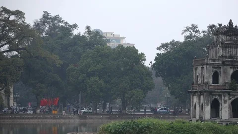 Time Lapse of Hanoi Turtle Tower Landmark People and Cars Traffic on Busy Street Stock Footage 104522647