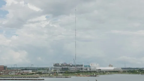 Time-lapse of harbor and Stadium building at a distance Video stock 104768673