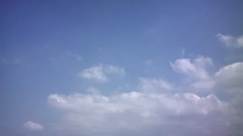 Time lapse of heavenly 3/4 backlit clouds in motion, with a blue sky background Stock Footage 274177011