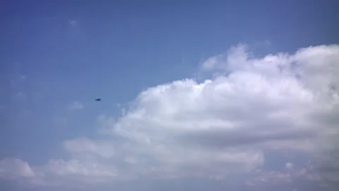 Time lapse of heavenly 3/4 backlit clouds in motion, with a blue sky background Stock Footage 274177015