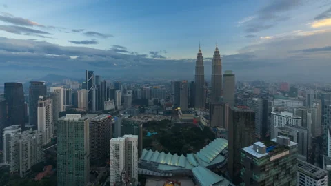 Time lapse: High angle cityscape view during dusk overlooking the Kuala Lumpur Stock Footage 225737733