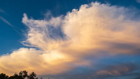 Time Lapse of High Clouds turning from White to Yellow to Blue Stock Footage 278341302