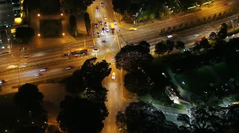 Time-lapse high view of a busy road junction at night in Singapore Video stock 11409999