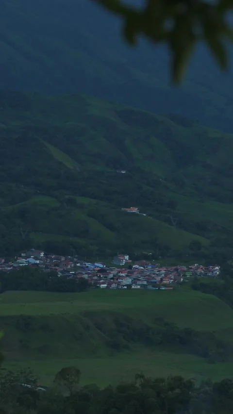 Time lapse from high view of hillside town sunset. 動画素材 330085477