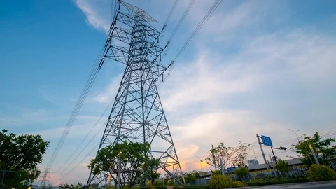 Time lapse High voltage pole and Power Plant Engineering near road Stock Footage 107678662