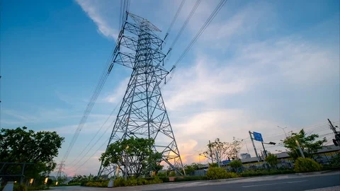Time lapse High voltage pole and Power Plant Engineering near road Stock Footage 107678679