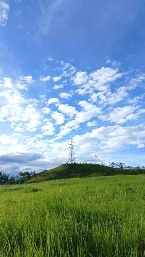 Time lapse of High voltage power line in the blue sky with cloud and green hill Stock Footage 297165319
