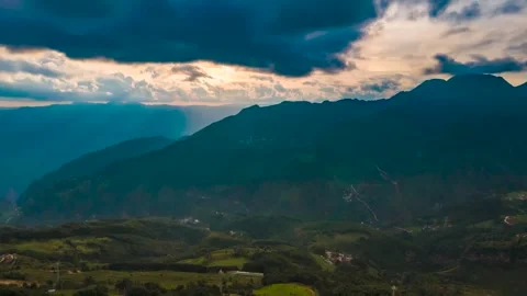 Time-Lapse Highland Mountain Range with Dramatic Weather Changes and Sunset Glow Stock Footage 341908696