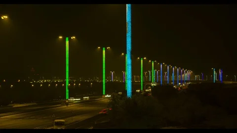 Time Lapse of highway in doha, Qatar, night, with rainbow lights, tilt shot Stock Footage 108444035