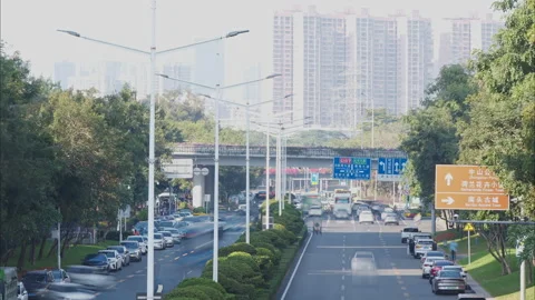 Time Lapse Highway: Non-Stop Traffic Flow with Distant Chinese City Skyline (Pro Stock Footage 322020115