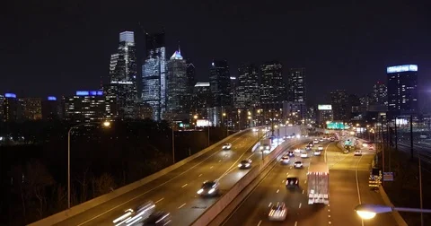 Time-lapse of highway traffic and the Philadelphia skyline at night Stock Footage 77066328
