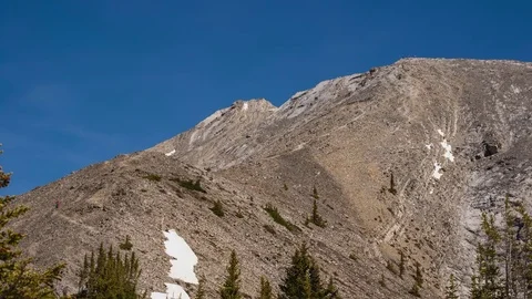 Time lapse of hikers summiting the last pitch of mountain Stock Footage 74322141