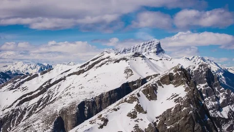 Time lapse of hikers summiting mountain from a distance Stock Footage 74598969