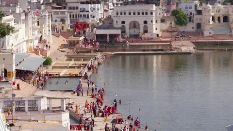 Time lapse Hindu pilgrims gather on the ghats to bathe at the holy sacred Pushka Stock Footage 70519306