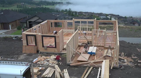 Time-lapse, home construction, house framing all day long with fog Stock Footage