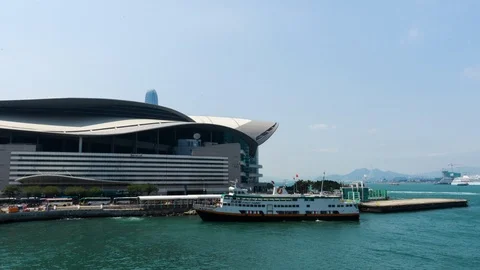 Time-lapse Hong Kong Convention Center on clear sunny day Stock Footage 87965653