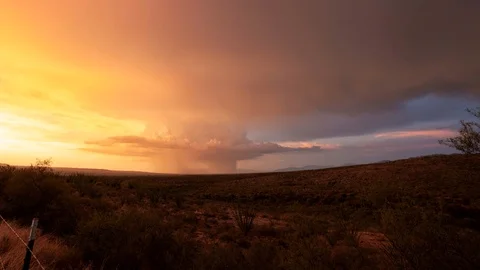 Time lapse of a huge summer storm at sunset with lightning Stock Footage 118700567