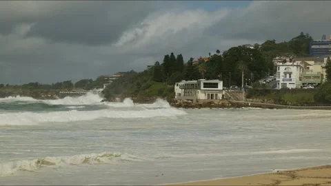 Time lapse huge waves crash around Coogee Surf Life Saving Club in Sydney Stock Footage 305607334