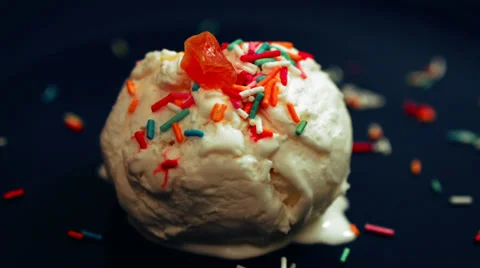 Time-lapse of ice-cream melting, with with bright sprinkles Stock Footage 35182294