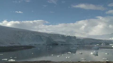 Time lapse ice face, clouds and sea ice, Antarctica Stock Footage 34314975