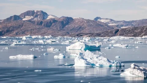 Time-lapse of icebergs drifting in large Sermilik fjord of East Greenland Stock Footage 332380877