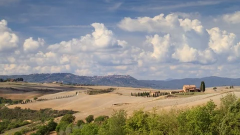 Time lapse of Iconic Tuscan landscape in Senese clays, with hill, house, cypress Stock Footage 81159455