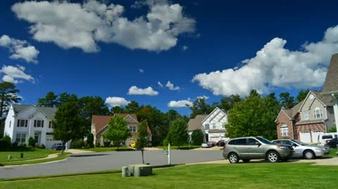 Time lapse of idyllic suburbs with homes on a cul de sac and rolling cumulus clo Stock Footage 12008885