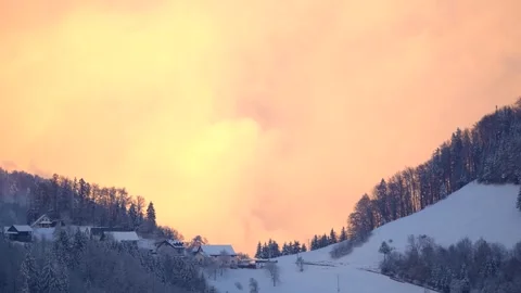 Time-lapse of illuminated clouds moving over an idyllic village Stock Footage 293563668