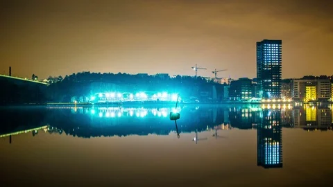 Time Lapse of illuminated construction site and tower block building at night Stock Footage 71183631