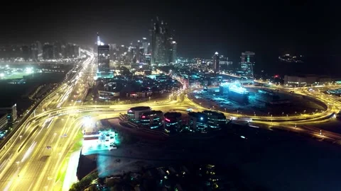 Time-Lapse of Illuminated Highways and City Skyline at Night Stock-Footage 332684412