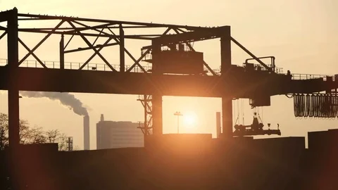Time lapse of industrial crane moving cargo containers at sunset time Stock Footage 72867353