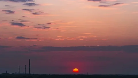 Time Lapse of Industrial pollution and smog sunrise with sun rays and dark Stock Footage 75330254