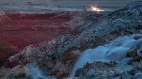 Time lapse. Industrial waterfall. Sunset. Drag-line excavator loads ore into Video stock 64510464