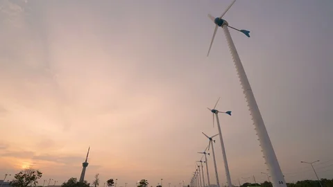 Time lapse industrial windmill farm while sunset Stock Footage 107769895