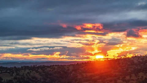 Time Lapse Intense Sunset Behind Clearing Storm Clouds Stock Footage 279688564