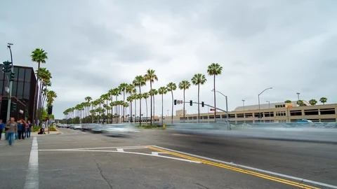 Time lapse intersection at John Wayne Airport with blurred cars driving by. Stock Footage 109475460