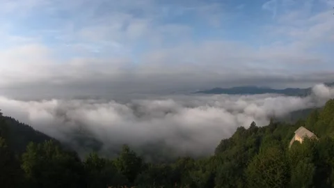 Time lapse inversion clouds moving in the valley Stock Footage 138589361