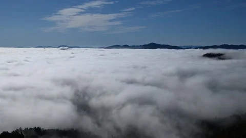 Time lapse of inversion clouds moving in the valley Stock Footage 154686073