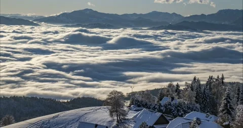 Time lapse of inversion clouds moving in alpine valley Stock Footage 166880074