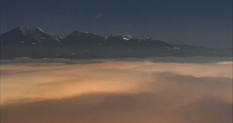 Time lapse of inversion or low clouds moving in the valley Stock Footage 169698207