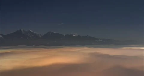 Time lapse of inversion or low clouds moving in the valley at night Stock Footage 169698556