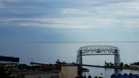 Time lapse of iron ore ship going under aerial lift bridge in Duluth MN Video stock 93768529