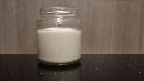 Time lapse of a jar with beer yeast rising. Dough preparation for pizza Stock Footage 144578049