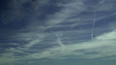 Time Lapse of Jet Contrails Mixed with Natural Cirrus Stock Footage 54731788