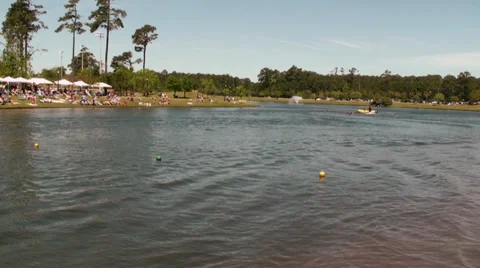 Time lapse of jet ski pulling a rubber boat on a lake Stock Footage 37708738