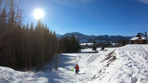 Time lapse of kid sledding through the hill in winter Zakopane, Poland. Stock Footage 152451604