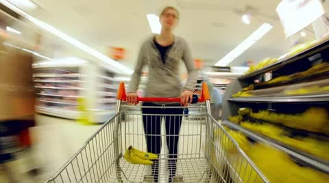 Time Lapse of Lady pushing trolley in Supermarket Stock Footage 10592193