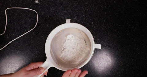 Time Lapse Of Lady Sieving Flour Into Batter To Prepare For Baking To Make Stock Footage 109202816